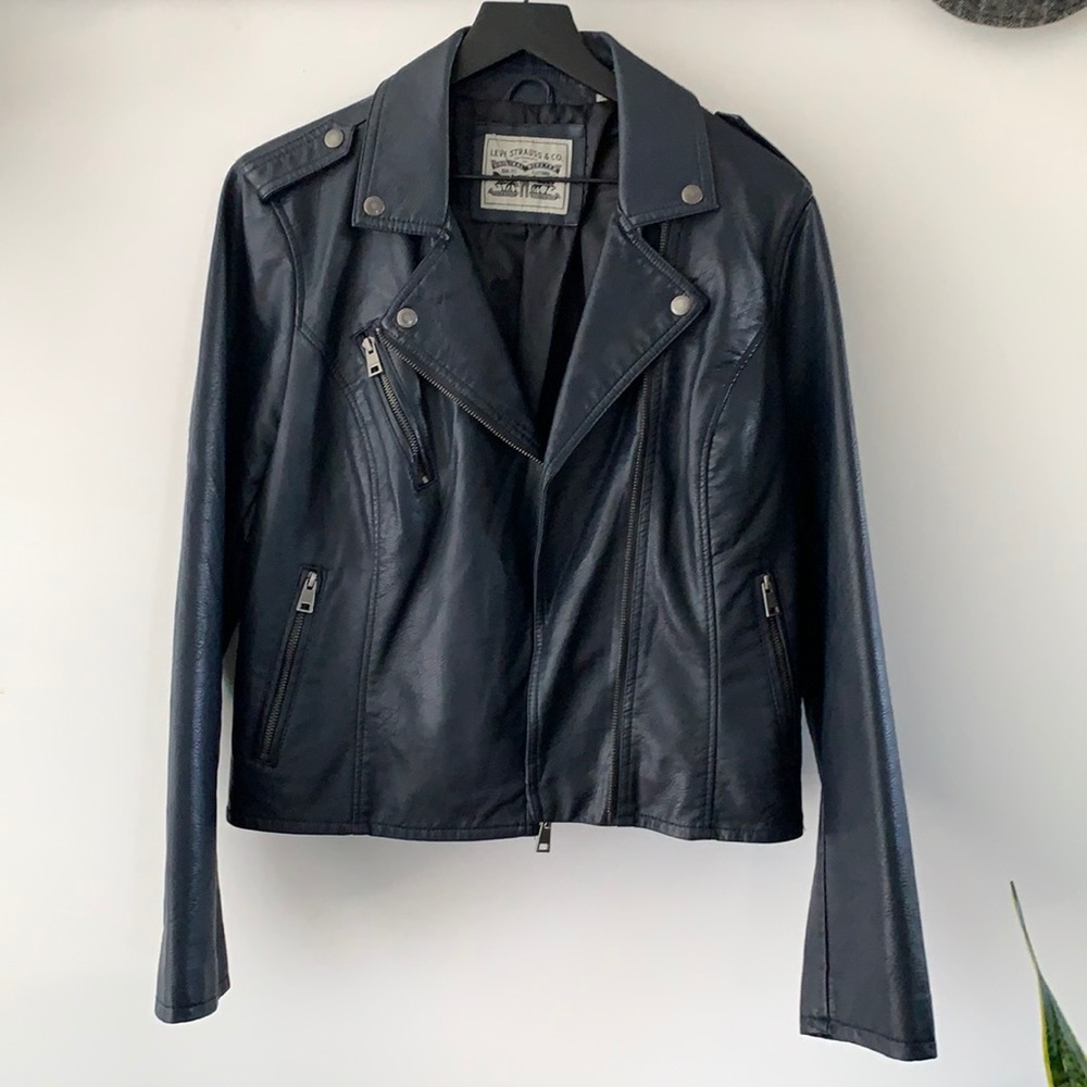 Ladies navy blue pleather jacket! Never worn, lots of snap and zipper details!